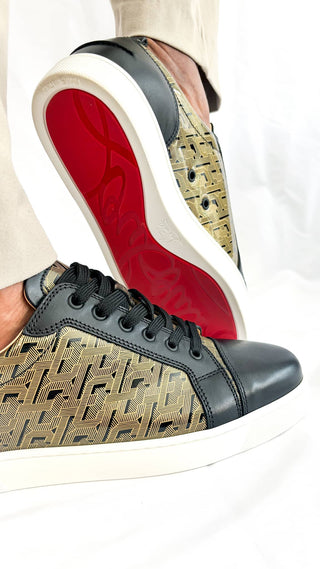 Close-up of Christian Louboutin Louis Men’s Sneakers highlighting red outsole, textured panels, and polished finish