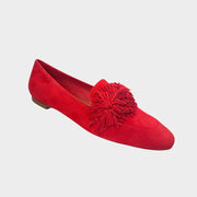 Side profile of Aquazzura Wild Thing loafers in red suede, highlighting the round toe and playful fringe tassel accent on the vamp.