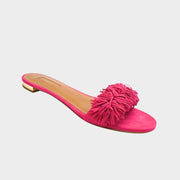 Side profile of Aquazzura Wild Thing sandals in bright pink suede, highlighting the fringed open almond toe and low block heel.