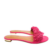 Full side angle view of an Aquazzura Wild Thing pink suede sandal, showcasing the flat slide silhouette and smooth leather insole.