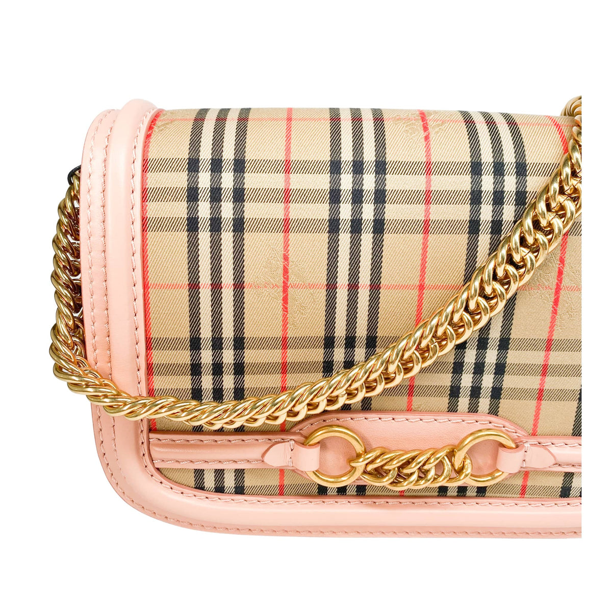 Detailed close-up of the front flap on the Burberry Link bag, showcasing the signature gold-tone chain link embellishment.
