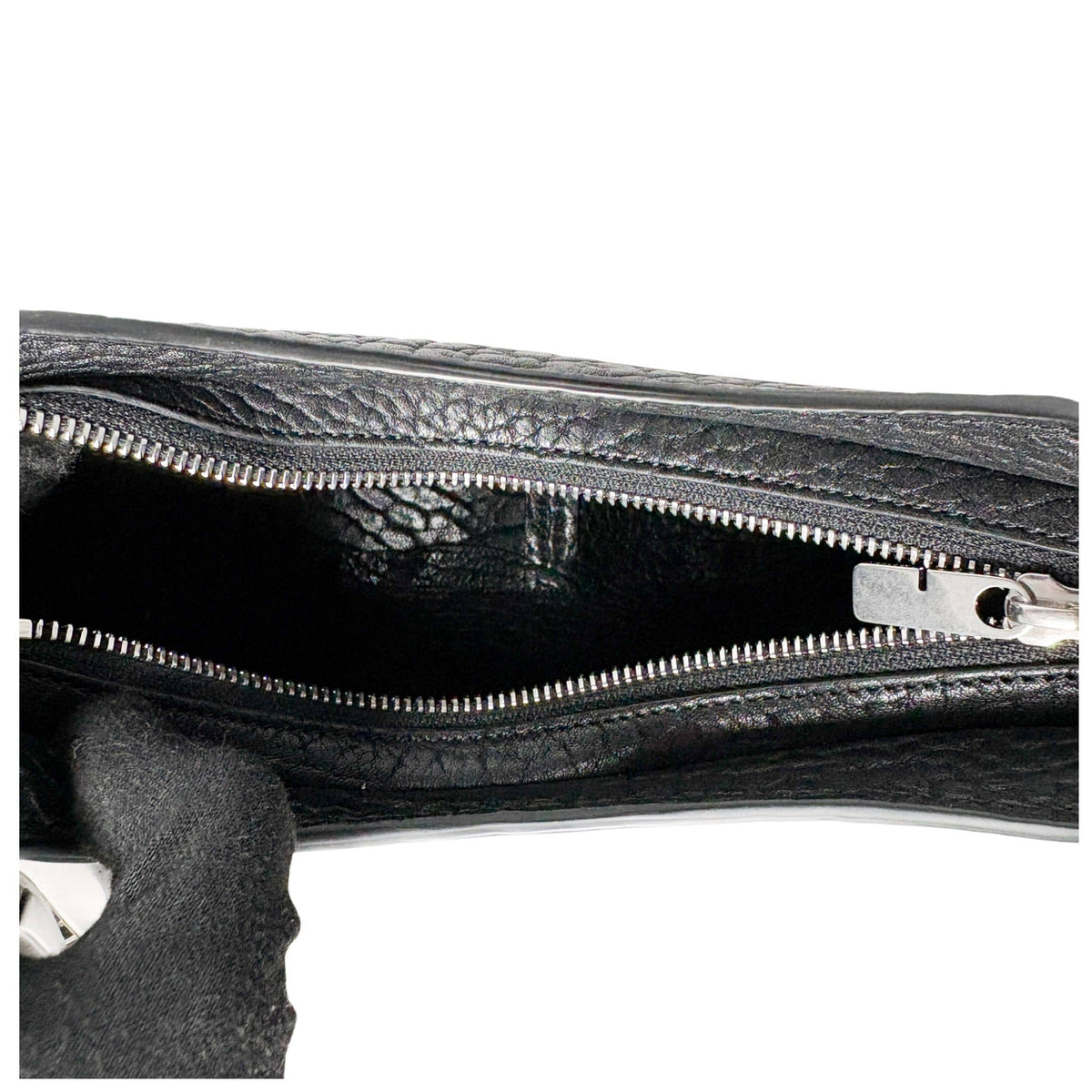 Interior view of the open black Burberry Chess leather bag, showing the spacious inner compartment and clean lining.