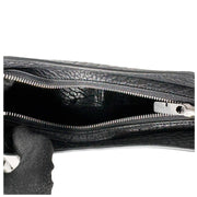 Interior view of the open black Burberry Chess leather bag, showing the spacious inner compartment and clean lining.