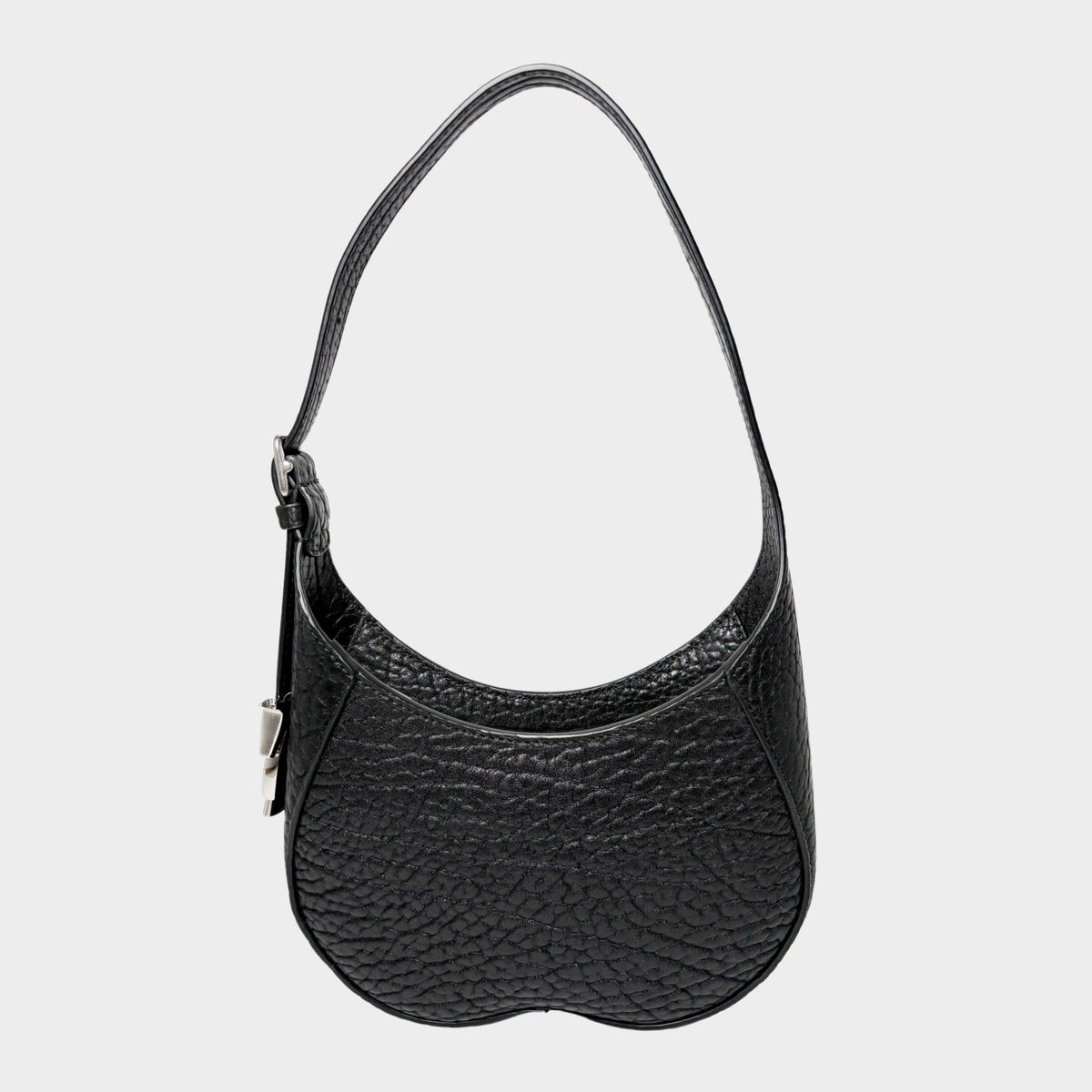 Front view of the luxury Burberry Chess shoulder bag in black textured leather, showcasing its unique curved silhouette and silver-tone hardware