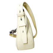 Side profile of the Burberry Knight lime yellow bag, showcasing the adjustable leather shoulder strap and buckle detailing
