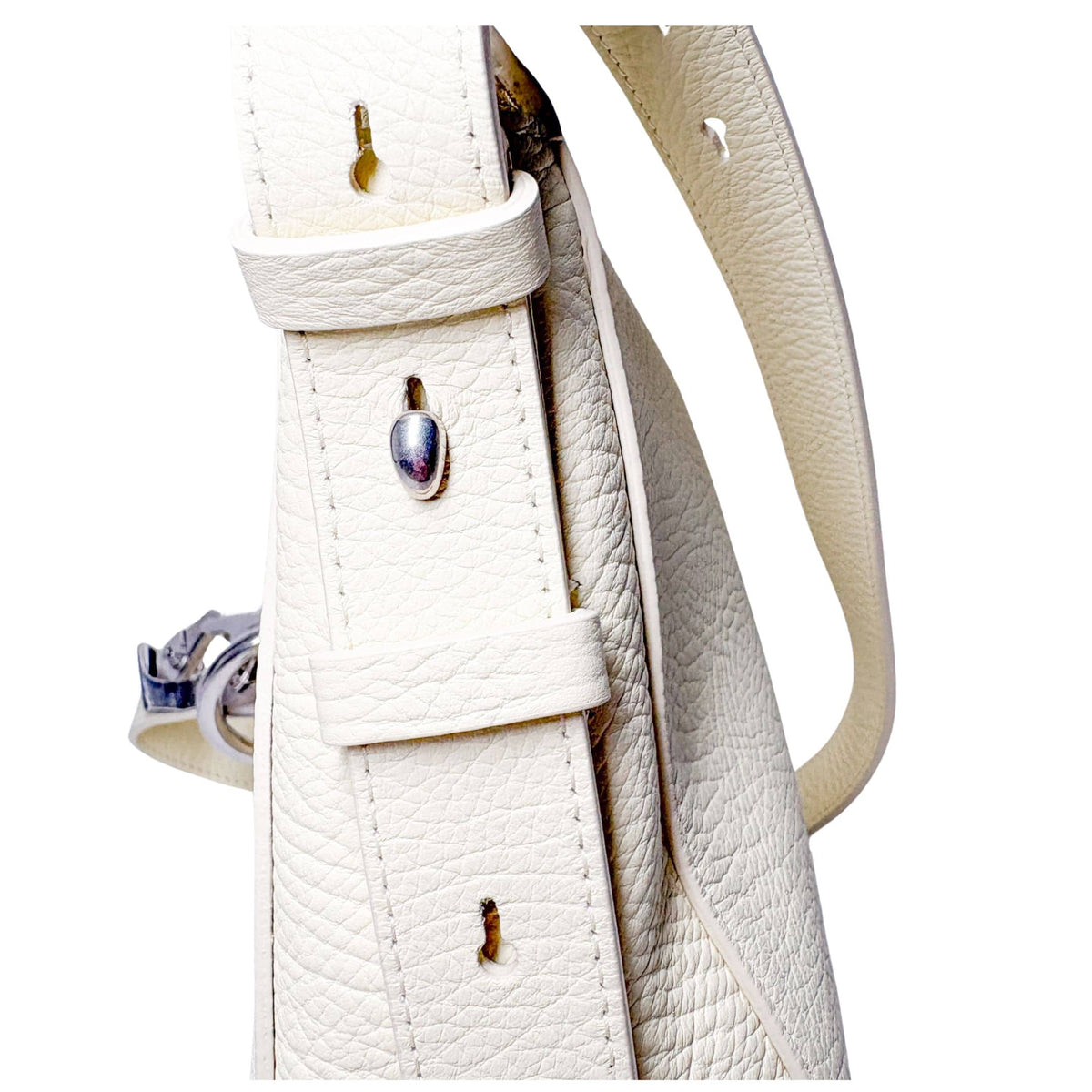 Detailed close-up of the silver-tone zipper closure and textured leather trim on the lime yellow Burberry Knight bag.