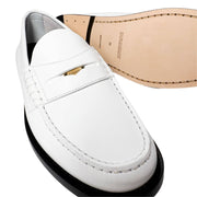Underside view of the Burberry Rupert Coin Loafers, showcasing the smooth tan leather outsole and structured heel.
