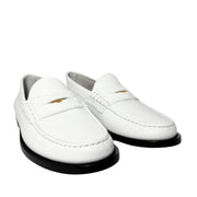 Rear view of the white Burberry Rupert Coin Loafers from behind, highlighting the clean leather heel counter and stitching