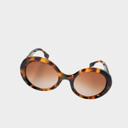 Front view of Burberry round sunglasses featuring dark tortoiseshell frames and brown gradient lenses.