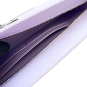 Interior view of the lilac Burberry TB leather bag, showing the spacious divided compartments and premium purple lining.