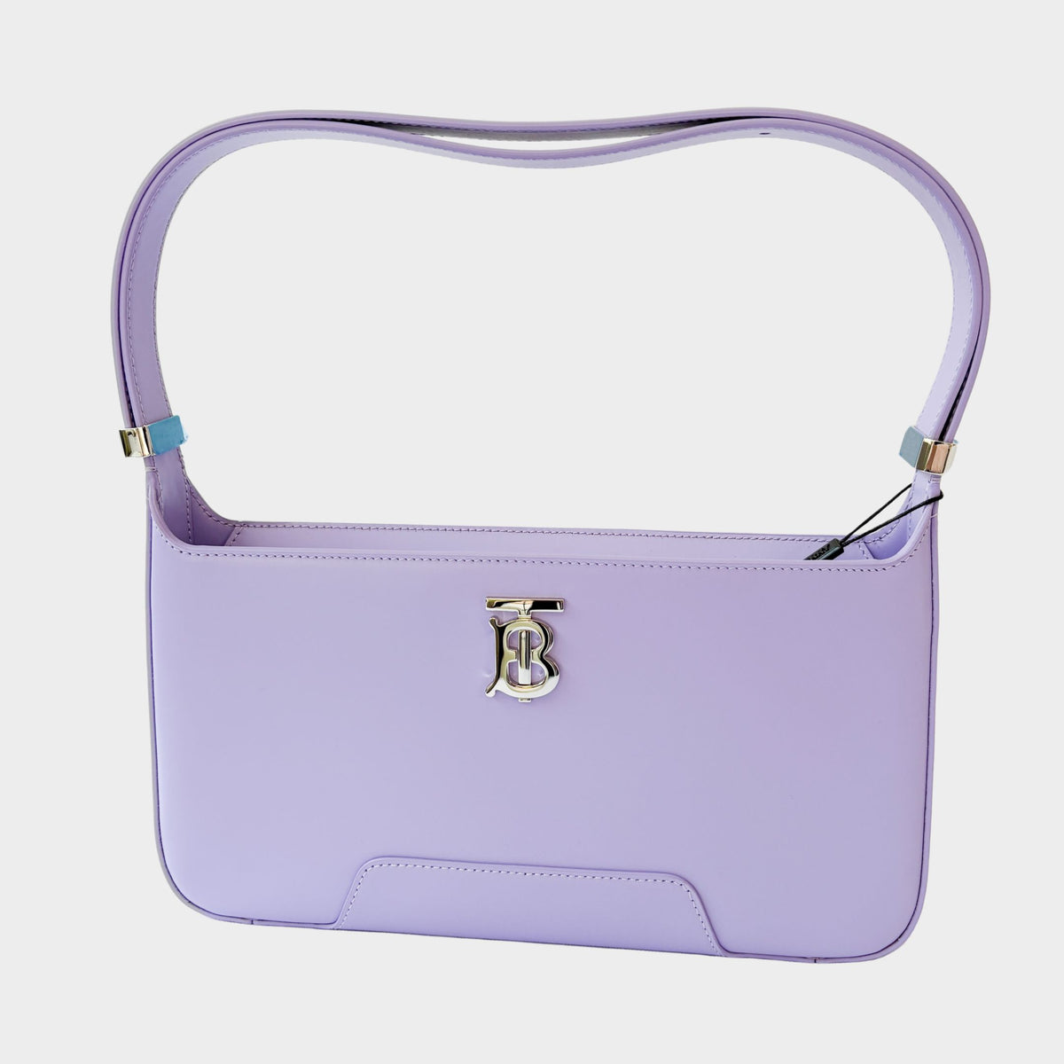 Front view of the luxury Burberry TB shoulder bag in lilac purple leather, showcasing the silver-tone TB monogram clasp.