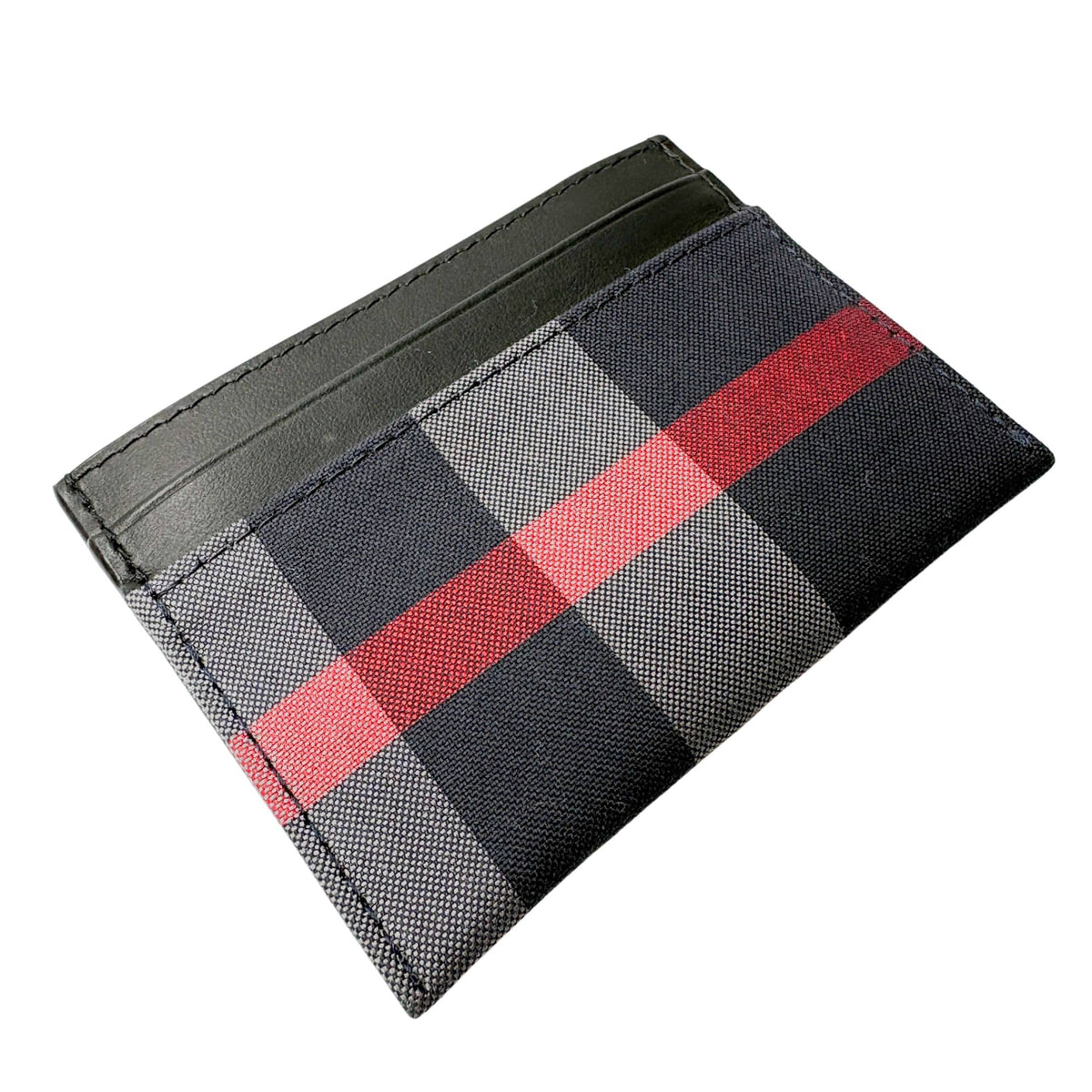 Three-quarter angled studio shot of Burberry House Check leather card holder highlighting the slim, compact profile and central pocket.