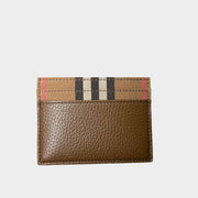 Front view of Burberry brown leather card holder featuring classic House Check canvas trim and card slots.