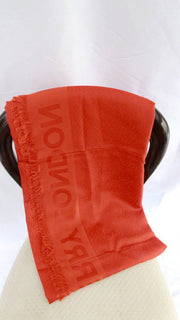 Burberry Monogram jacquard silk-wool scarf in vermillion red wrapped around a neck display stand.