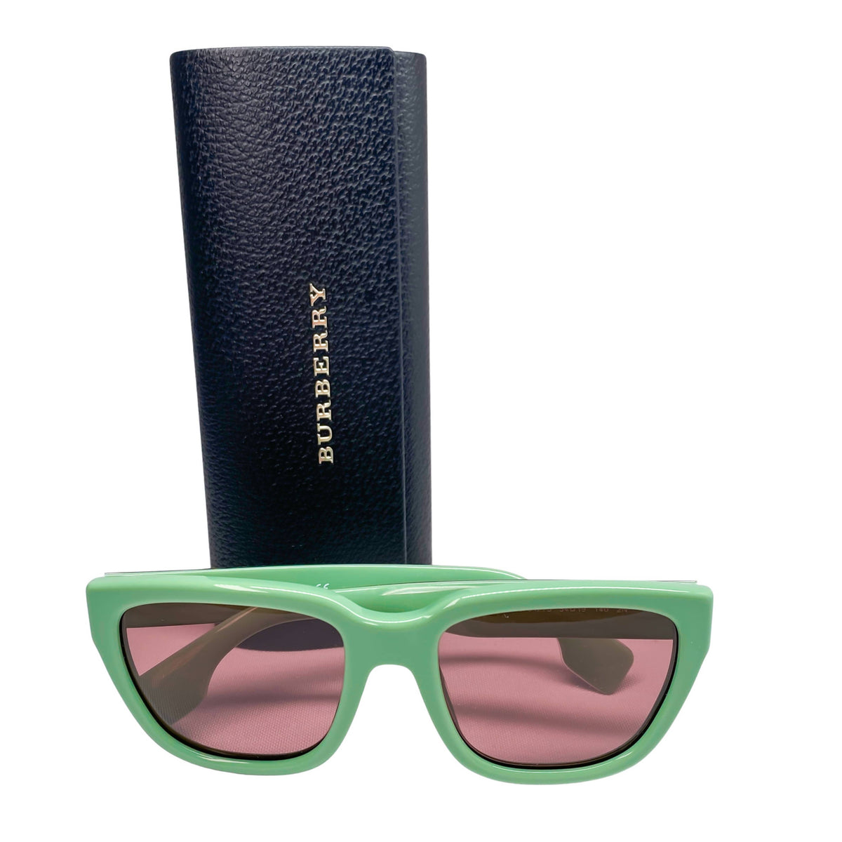 Burberry mint green rectangle sunglasses displayed resting in front of the included black protective hard case.