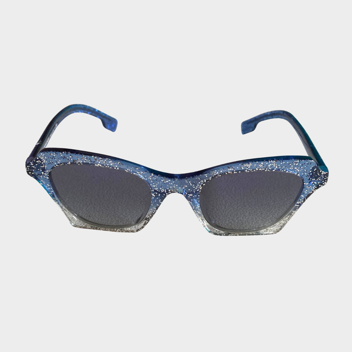 Front view of Burberry sparkly blue rectangle sunglasses with dark tint lenses and silver glitter accents.