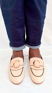Front perspective wearing shot of the pink Chloé C patent leather loafer flats, focusing on the golden C hardware accent.