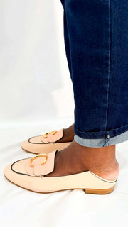 Rear view of a pair of Chloé C pink patent leather loafers from behind, showing the clean stitching and convertible heel counter structure.