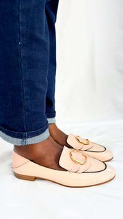 Side angle on-foot view of the Chloé C pink patent leather loafers, showing the classic slip-on flat silhouette