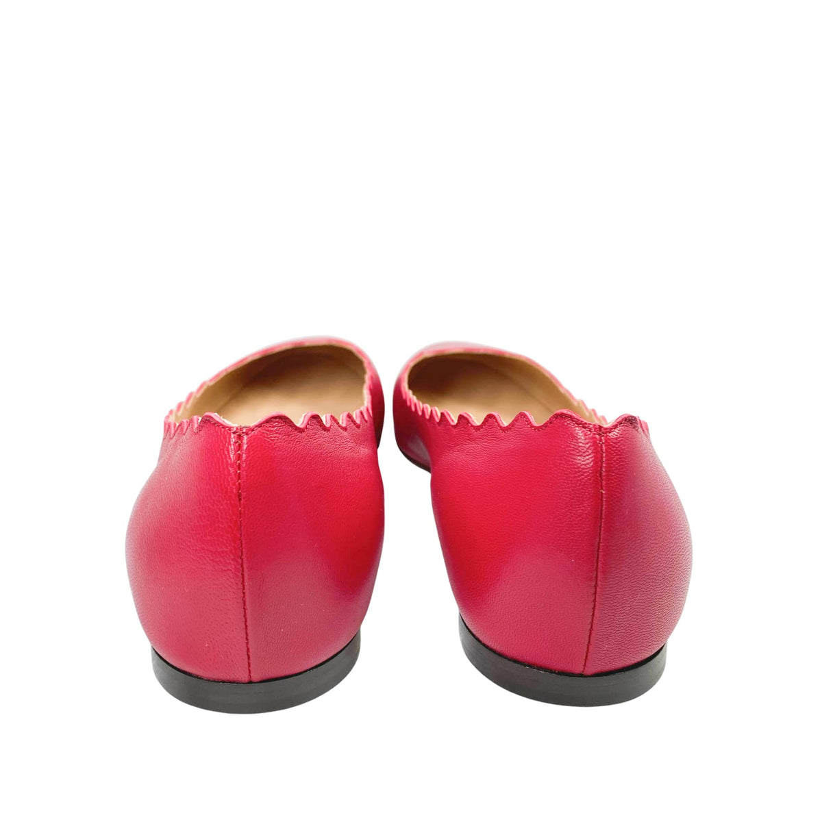 Rear view of Chloé Lauren pink leather ballet flats from behind, focusing on the clean heel counter stitching and flat sole profile.