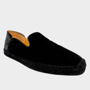 Side profile view of a Christian Louboutin Varsi Espadon slip-on espadrille in premium black suede, featuring neat topstitching and a classic woven jute midsole.