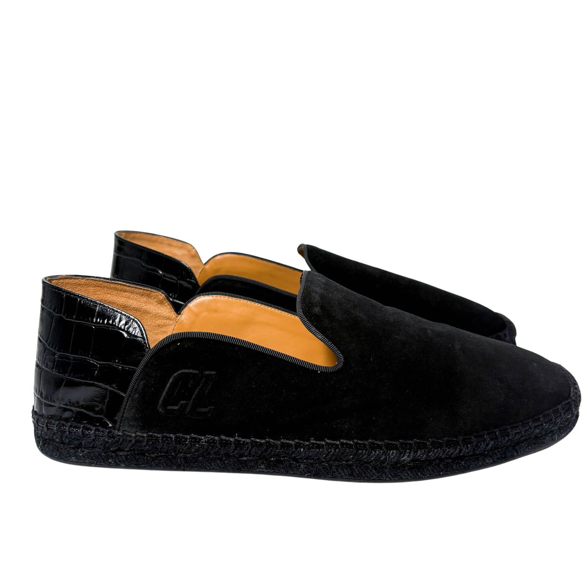 Rear view of the Christian Louboutin Varsi Espadon flat from behind, focusing on the structured suede heel counter and neat stitching.