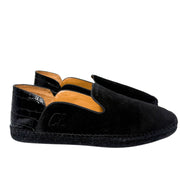 Rear view of the Christian Louboutin Varsi Espadon flat from behind, focusing on the structured suede heel counter and neat stitching.