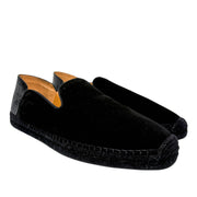 Angled side profile of the Christian Louboutin Varsi Espadon flat, highlighting the textured braided jute detailing and clean casual construction.