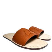 Three-quarter profile view of the Christian Louboutin Varsicool flat leather slides, showcasing the clean side-stitching.