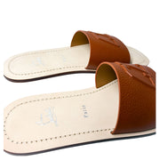 Medial view of the Christian Louboutin Varsicool leather sandal, showing the inner arch lining and contrast stitching.