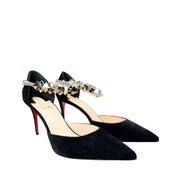 Side perspective studio shot of a pair of Christian Louboutin Planet Chic 90 black suede pumps positioned together against a white background.
