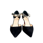 Symmetrical front angle view of the Christian Louboutin Planet Chic 90 heels, focusing on the sharp pointed toe and elegant ankle strap silhouette.