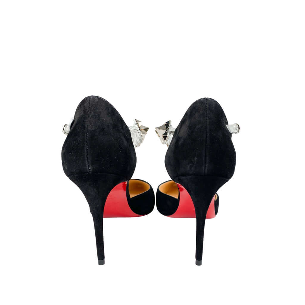 Rear view of the Christian Louboutin Planet Chic 90 pumps from behind, focusing on the structured heel counters and iconic signature red bottoms.