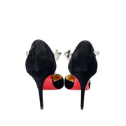 Rear view of the Christian Louboutin Planet Chic 90 pumps from behind, focusing on the structured heel counters and iconic signature red bottoms.