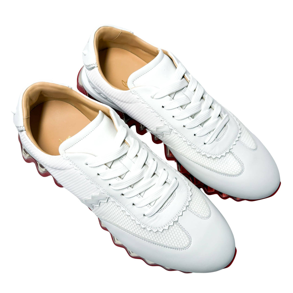Top-down front perspective of the white Christian Louboutin Loubishark men's sneakers, showing the symmetrical lace-up panel.