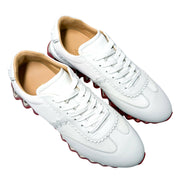 Top-down front perspective of the white Christian Louboutin Loubishark men's sneakers, showing the symmetrical lace-up panel.