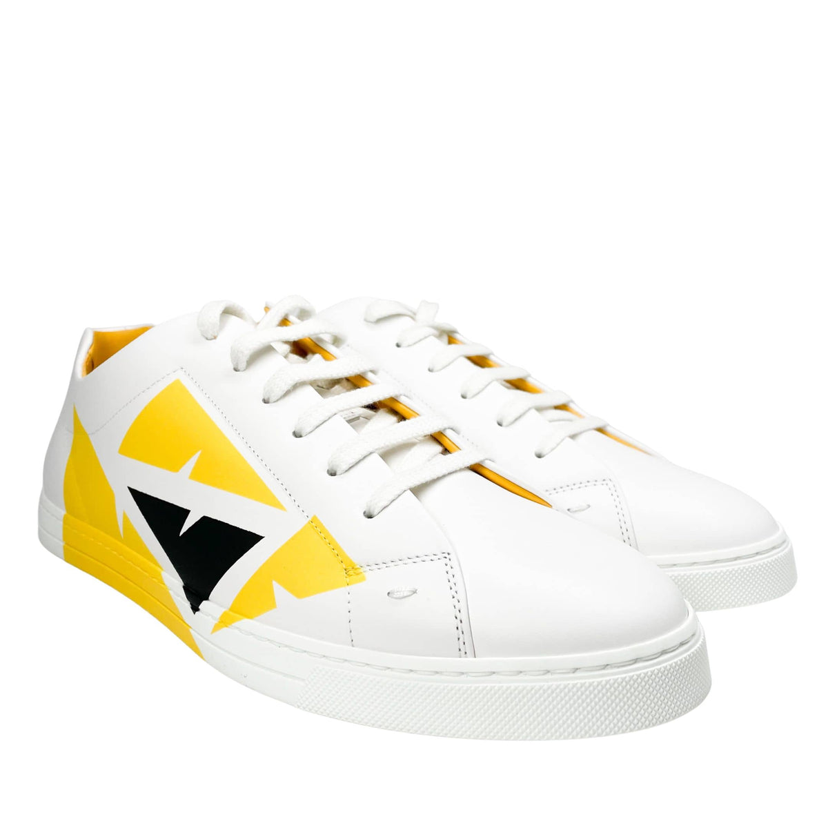 Front view of a pair of Fendi Painted Bag Bugs white leather sneakers with yellow eye graphic.