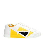 Side profile view of Fendi Bag Bugs white leather trainer displaying yellow and black graphic panel.