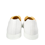 Back view of Fendi Painted Bag Bugs white leather sneakers showing yellow heel collar linings.