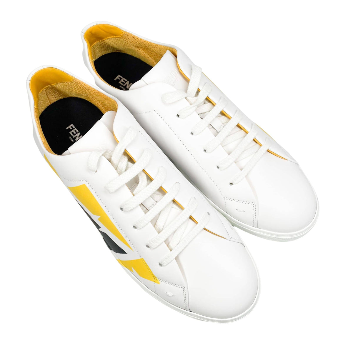 Overhead elevated pair view of men's Fendi Painted Bag Bugs white leather luxury sneakers.