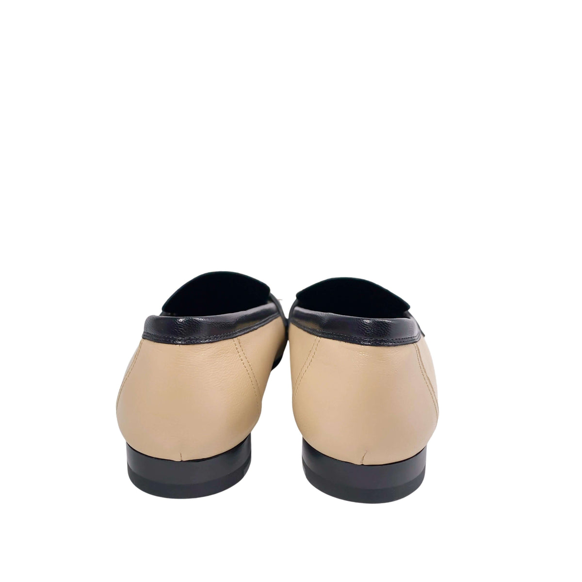 A parallel top-down glance looking directly into the open heel entries of the shoes, highlighting the premium leather inner lining and the refined casual styling.