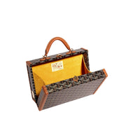 Open Goyard Grand Hôtel Trunk Bag showcasing bright yellow lining interior compartment and trunk construction.