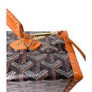 Close-up of Goyard Grand Hôtel Trunk Bag featuring tan leather shoulder strap and silver-tone metallic hardware.