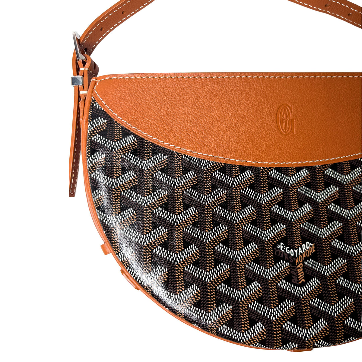 Front view of Goyard Hirondelle bag highlighting the crescent silhouette and contrasting leather trim.