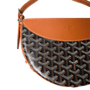 Front view of Goyard Hirondelle bag highlighting the crescent silhouette and contrasting leather trim.