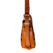 Narrow side profile view of Goyard Hirondelle bag detailing slim leather side construction and strap connection.
