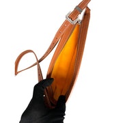 Top interior view of Goyard Hirondelle crossbody bag showing main compartment and tan leather interior flap.