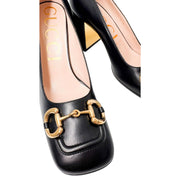 Overhead three-quarter view of the Gucci Baby Pumps, displaying the clean entry collar and the gold horsebit detail from above.