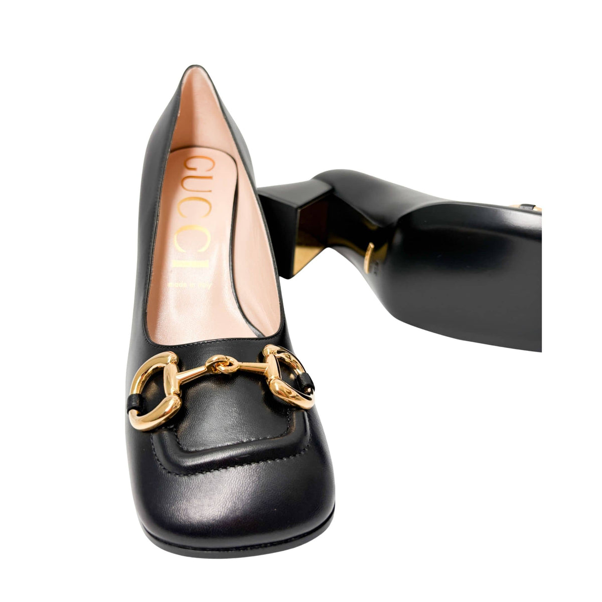Direct front-facing angle of a black leather Gucci Baby Pump, showcasing the polished finish and horsebit embellishment.