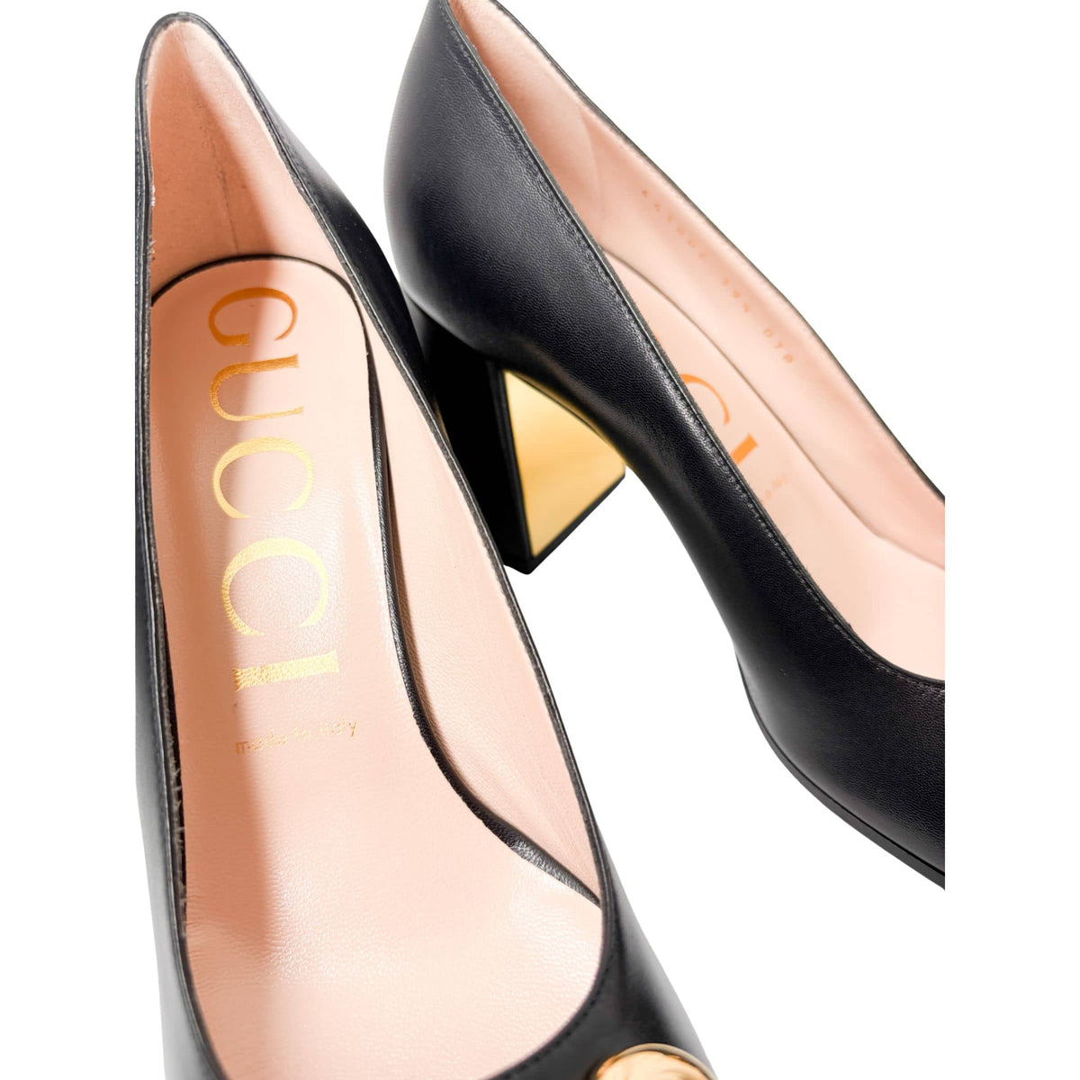 Close-up macro shot of the Gucci Baby Pump interior, showcasing the gold foil stamped Gucci logo on the premium leather insole.